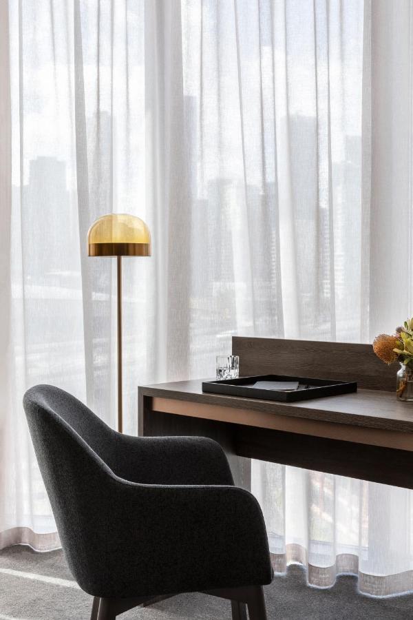 Oakwood Premier Melbourne Aparthotel Exterior photo A floor lamp
