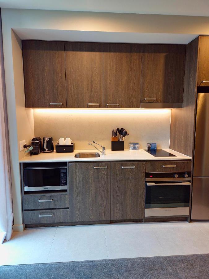 Oakwood Premier Melbourne Aparthotel Exterior photo Kitchenette in a hotel room