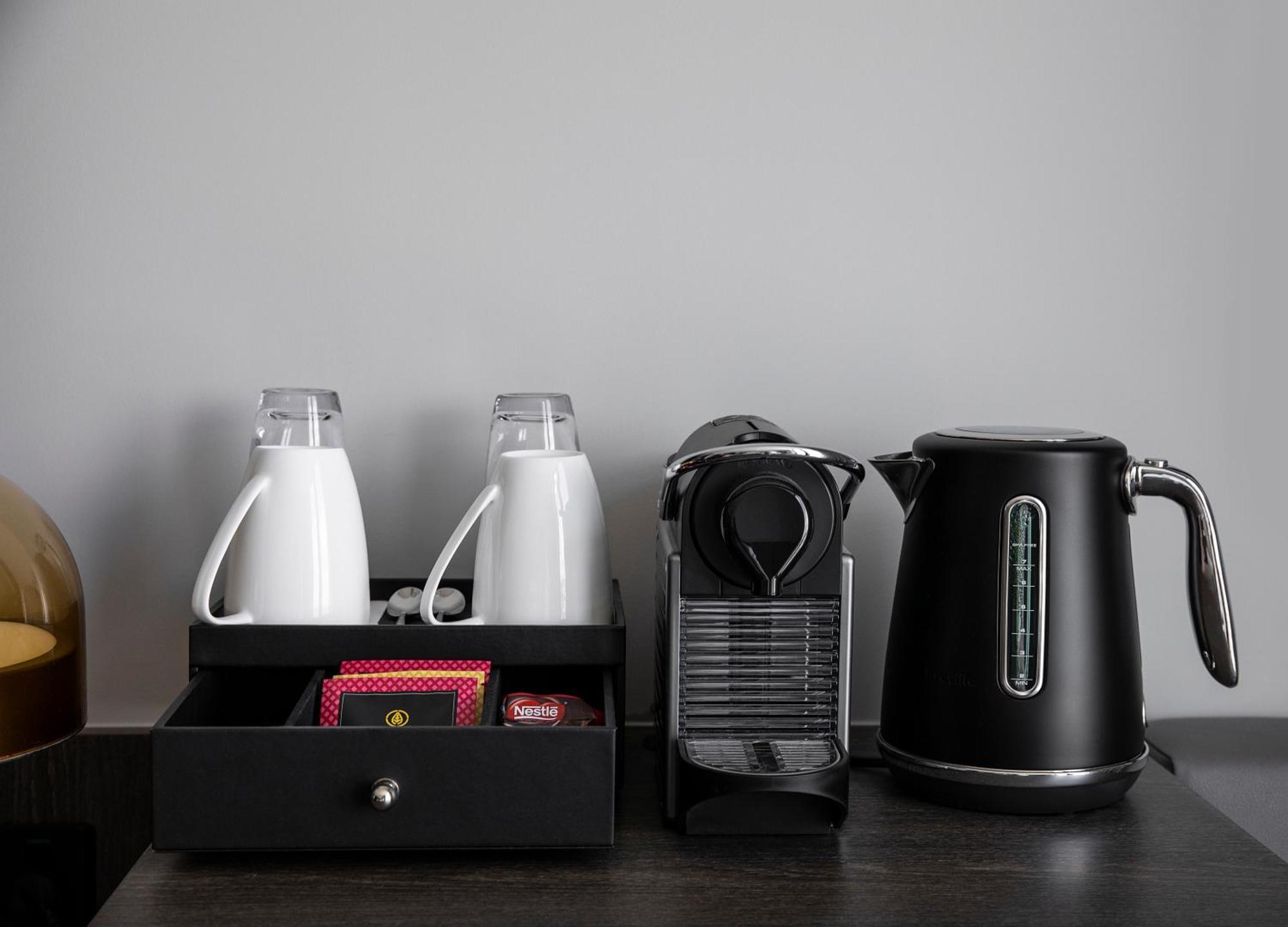 Oakwood Premier Melbourne Aparthotel Exterior photo A Nespresso coffee machine in a hotel room